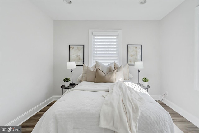 bedroom featuring dark hardwood / wood-style flooring