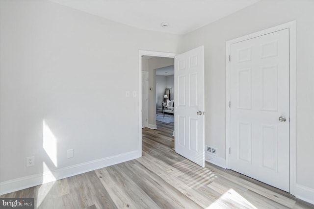 unfurnished bedroom featuring light hardwood / wood-style flooring