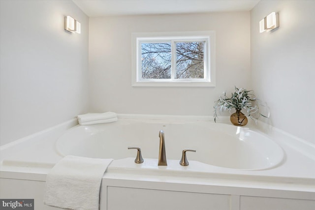 bathroom with a washtub