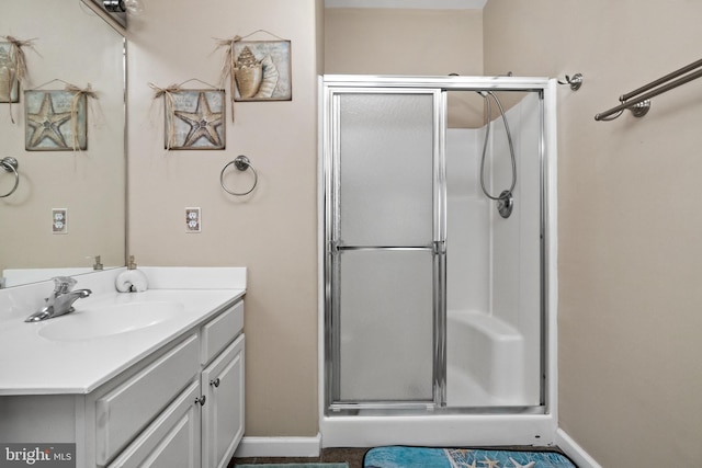 bathroom with vanity and walk in shower