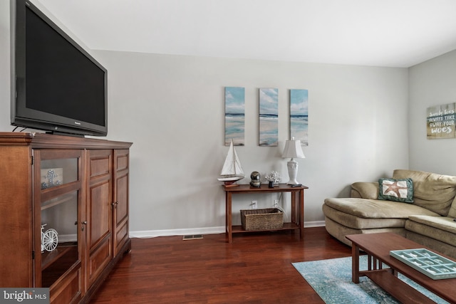 living room with dark hardwood / wood-style floors