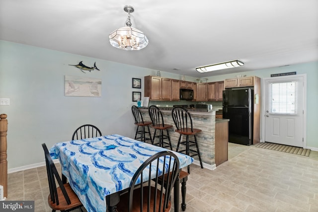 dining room with a notable chandelier