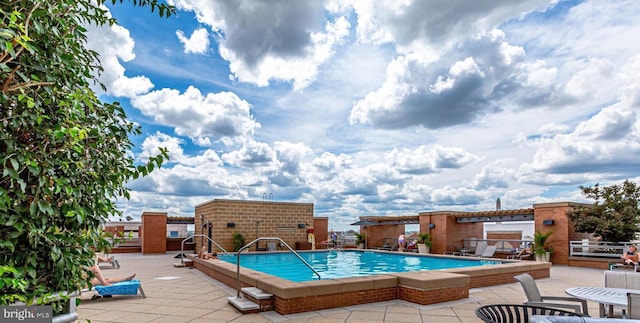 view of swimming pool with a patio area