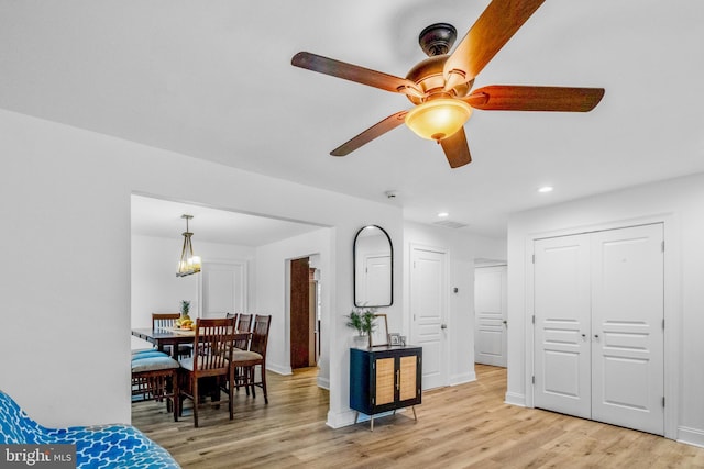 interior space with light hardwood / wood-style flooring and ceiling fan