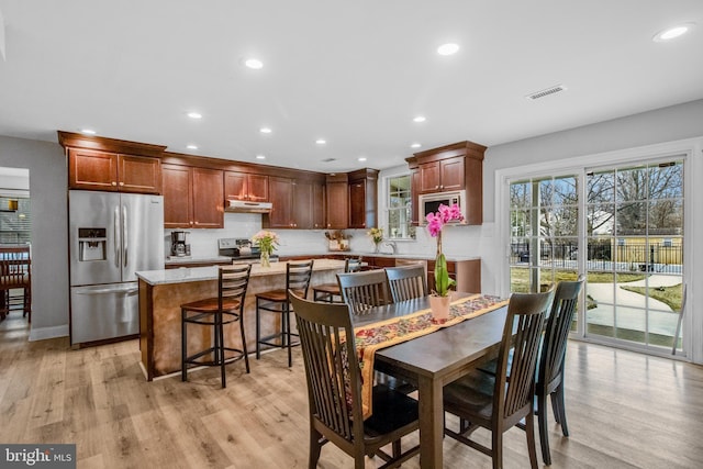 dining room featuring light wood-type flooring