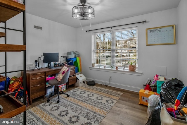 office with hardwood / wood-style flooring