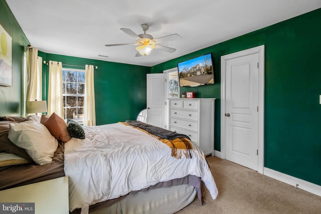 carpeted bedroom featuring ceiling fan