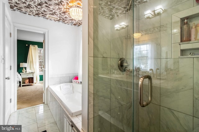 bathroom featuring separate shower and tub and plenty of natural light