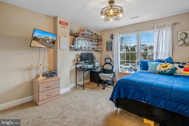 bedroom featuring light carpet