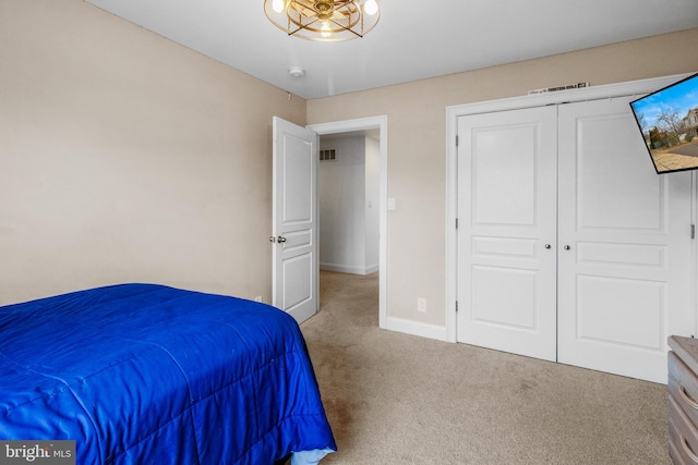 bedroom with carpet floors and a closet