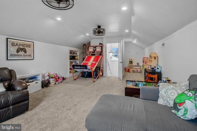 recreation room with vaulted ceiling and carpet