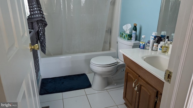 full bath with tile patterned flooring, toilet, vanity, and shower / bath combo