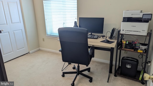 carpeted office with baseboards