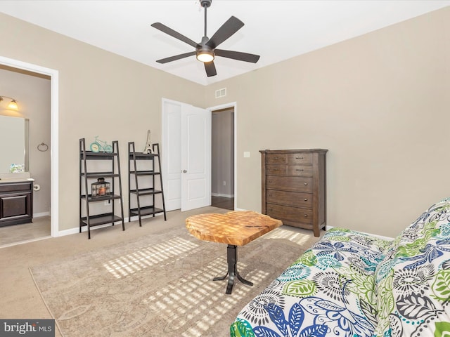 carpeted bedroom with baseboards, visible vents, and a ceiling fan