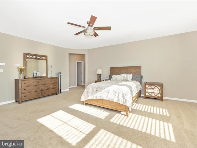 bedroom with carpet floors, baseboards, and a ceiling fan