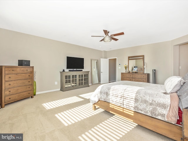 bedroom featuring a ceiling fan, baseboards, and carpet flooring