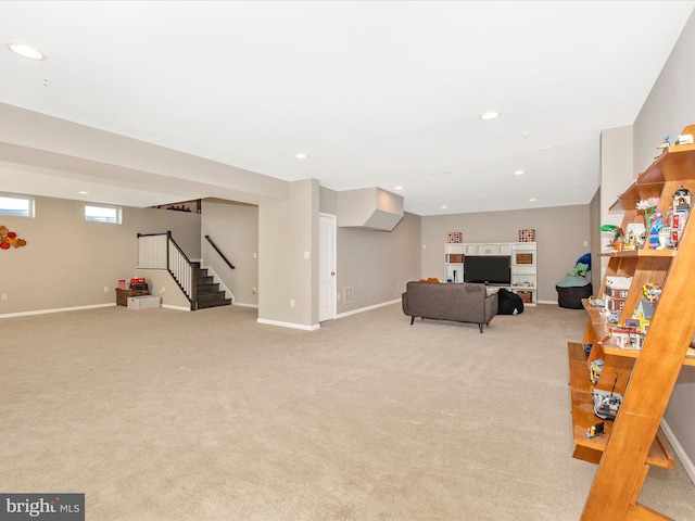 interior space featuring stairs, light carpet, baseboards, and recessed lighting