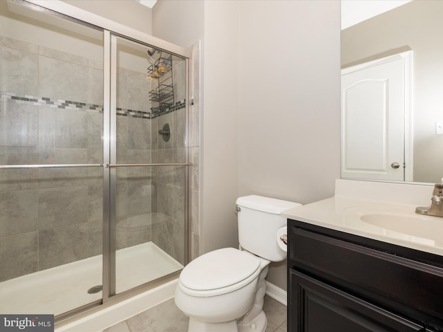 full bath with toilet, a stall shower, tile patterned flooring, and vanity