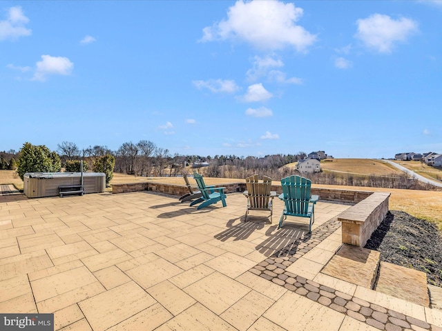 view of patio with a hot tub