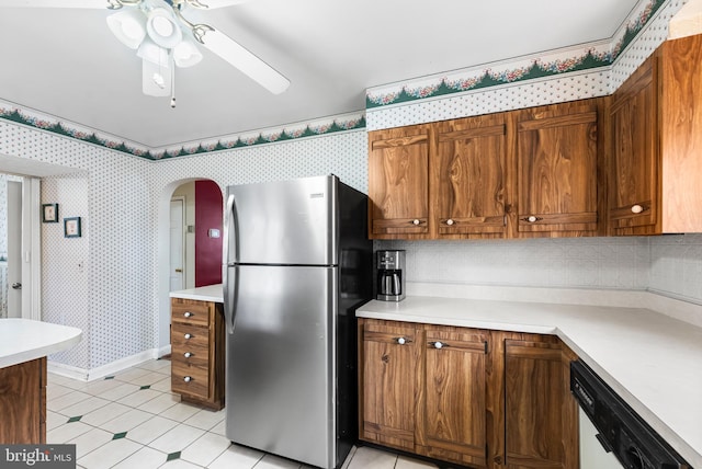 kitchen featuring stainless steel refrigerator, ceiling fan, and white dishwasher