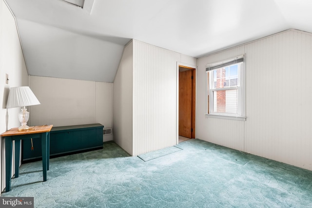 additional living space with lofted ceiling and carpet floors