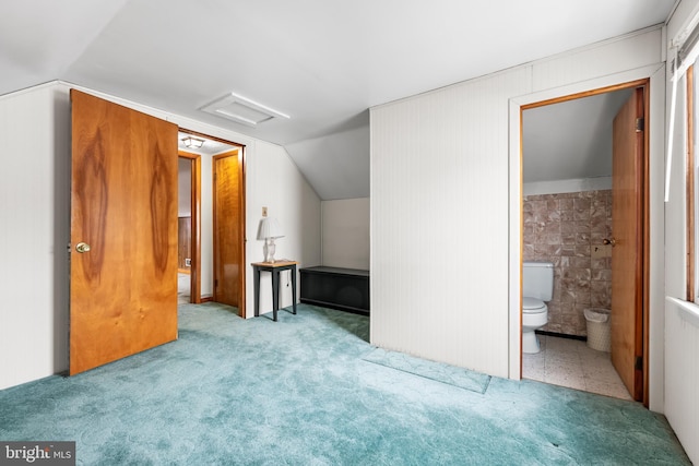 additional living space with lofted ceiling and light colored carpet