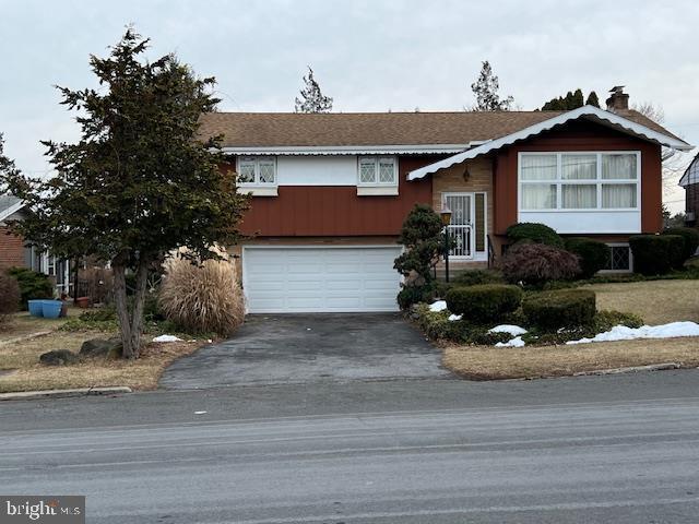 split foyer home featuring a garage