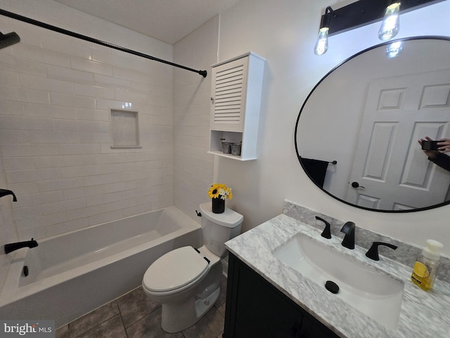 bathroom featuring vanity, tile patterned floors, toilet, and tub / shower combination