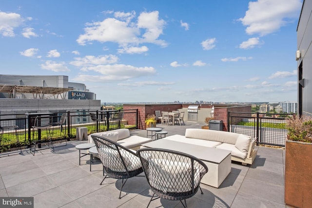 view of patio featuring an outdoor living space, exterior kitchen, and grilling area