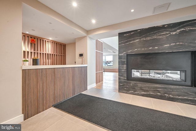 reception area featuring a multi sided fireplace