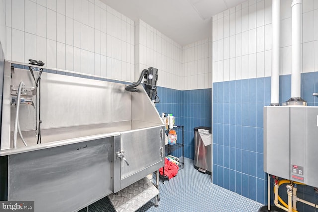 misc room with tile walls and tile patterned floors