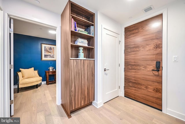 hallway featuring light hardwood / wood-style flooring