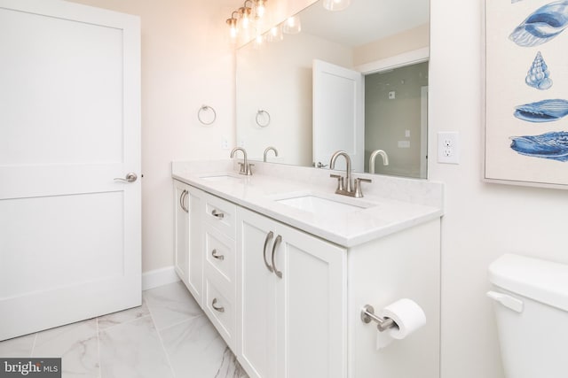 bathroom with vanity and toilet