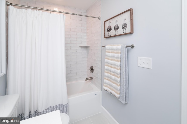 bathroom with shower / bath combination with curtain, tile patterned floors, and toilet