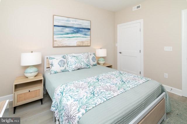 bedroom with light hardwood / wood-style flooring