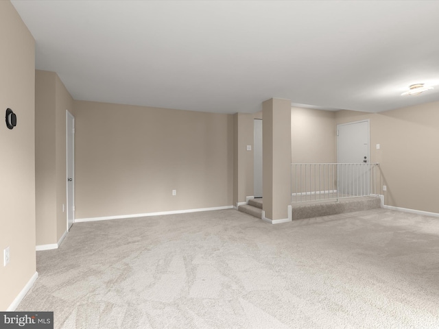 empty room featuring light colored carpet