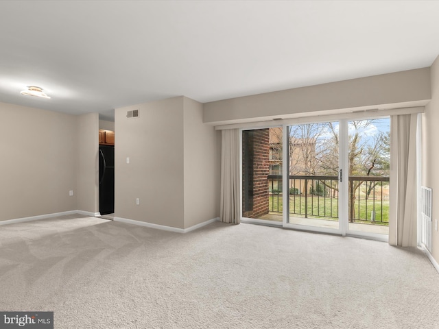 empty room with light colored carpet