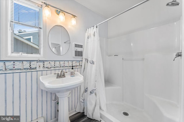 bathroom featuring curtained shower and sink