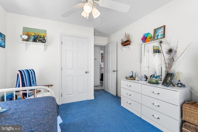 bedroom featuring ceiling fan and carpet