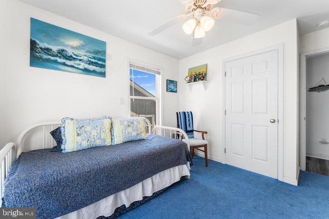 carpeted bedroom featuring ceiling fan