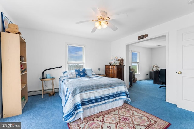 carpeted bedroom with ceiling fan and a baseboard heating unit