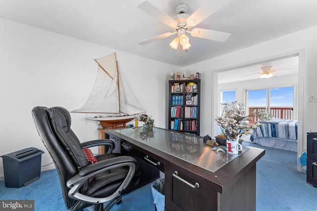 office featuring light carpet and ceiling fan