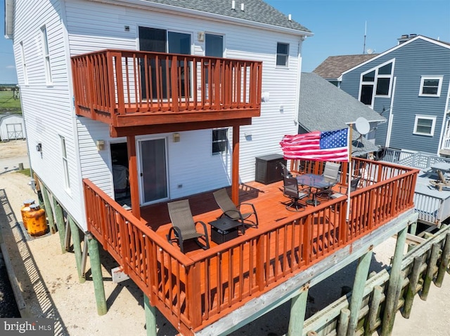 back of house featuring a deck