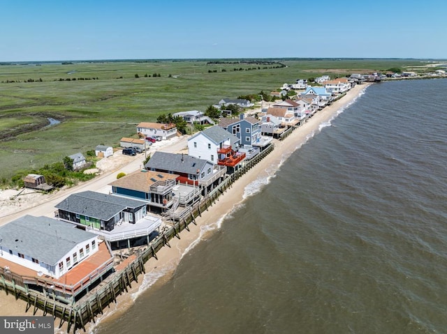 bird's eye view with a water view, a beach view, and a rural view