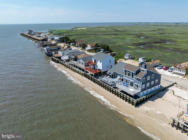 bird's eye view with a water view and a view of the beach