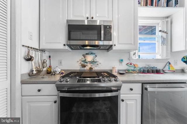 kitchen with white cabinetry and appliances with stainless steel finishes