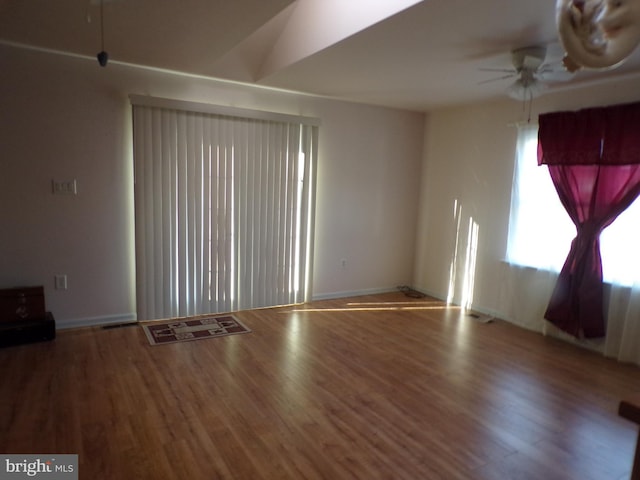 spare room featuring wood-type flooring and ceiling fan