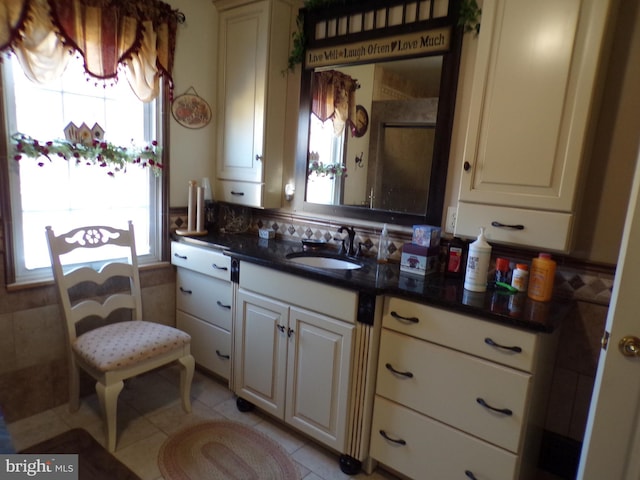 kitchen featuring light tile patterned flooring and sink