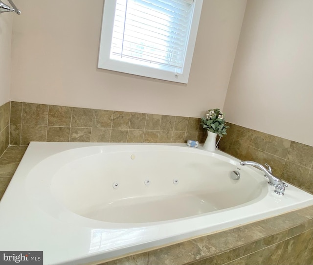 bathroom with tiled tub