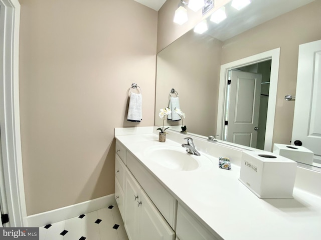 bathroom with tile patterned flooring and vanity